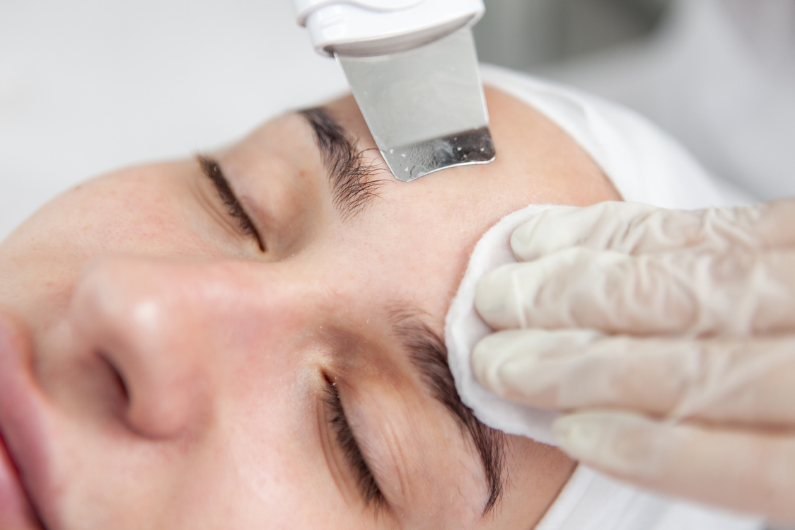 Beautiful woman receiving ultrasonic cavitation facial peeling.